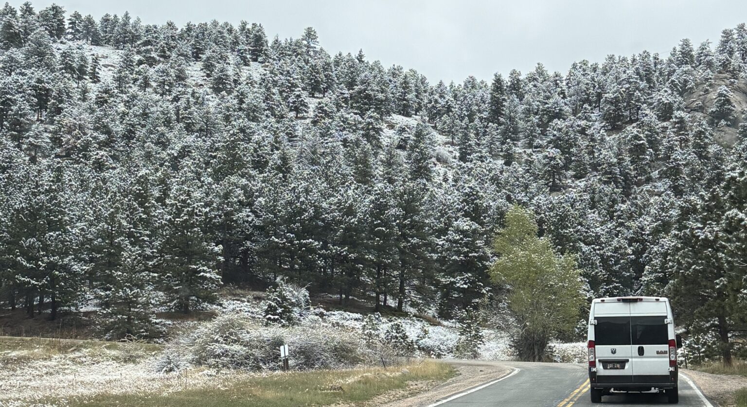 Mountain Hydronics Van on a snowy mountain road
